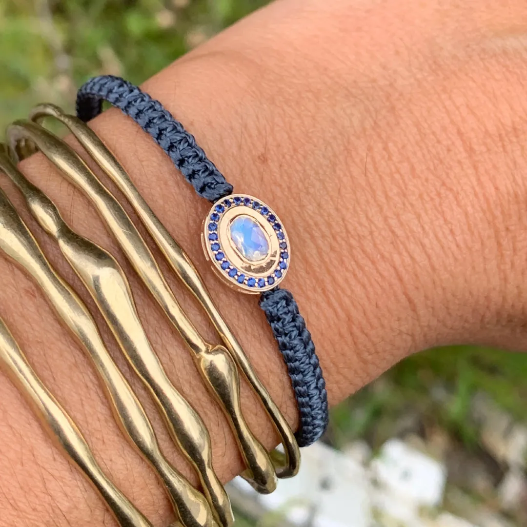 Moonstone and Sapphire braided bracelet in 10k yellow gold.