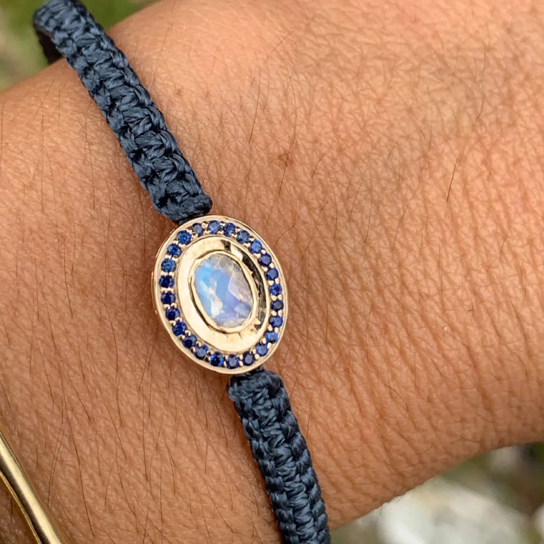 Moonstone and Sapphire braided bracelet in 10k yellow gold.