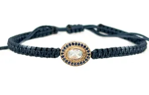 Moonstone and Sapphire braided bracelet in 10k yellow gold.