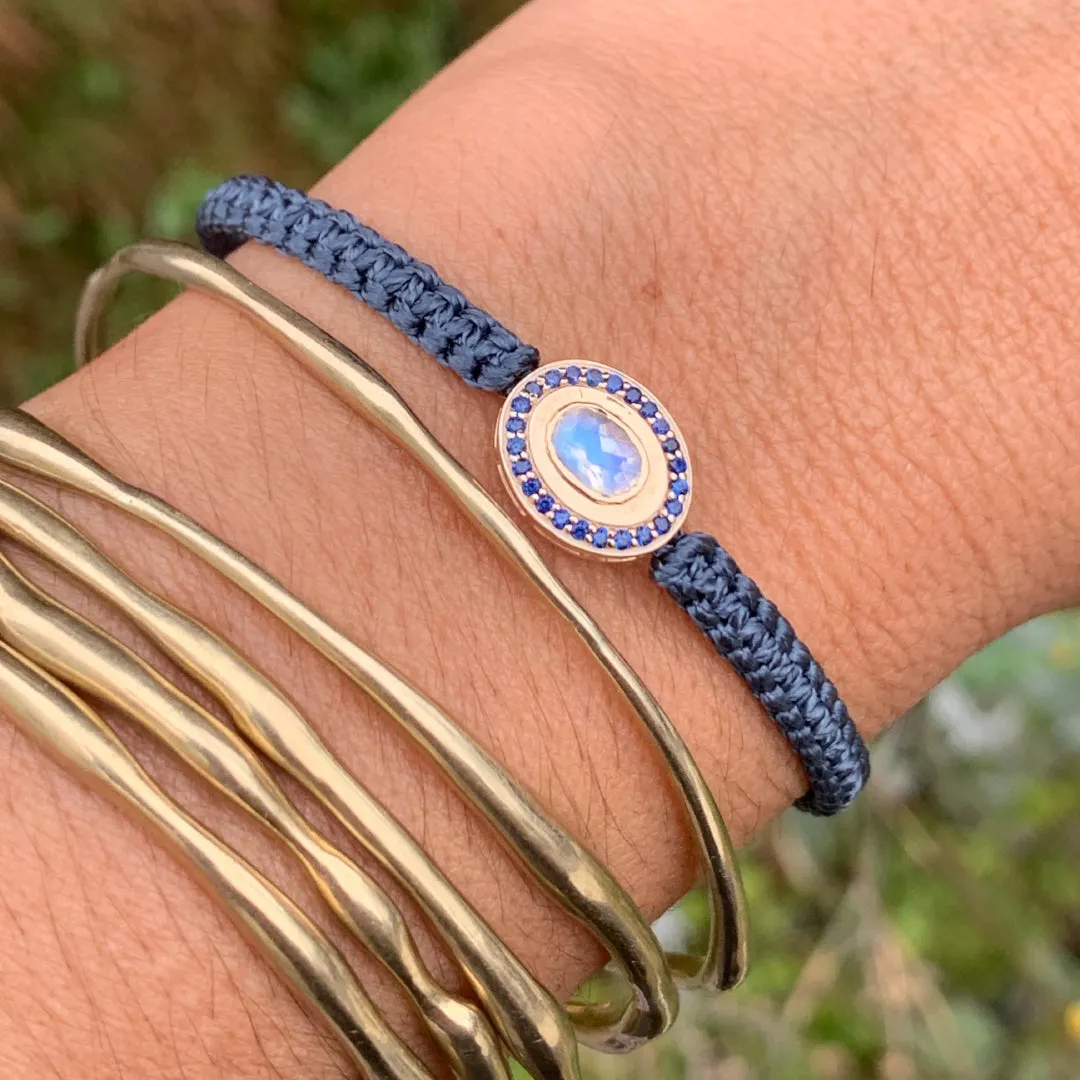 Moonstone and Sapphire braided bracelet in 10k yellow gold.