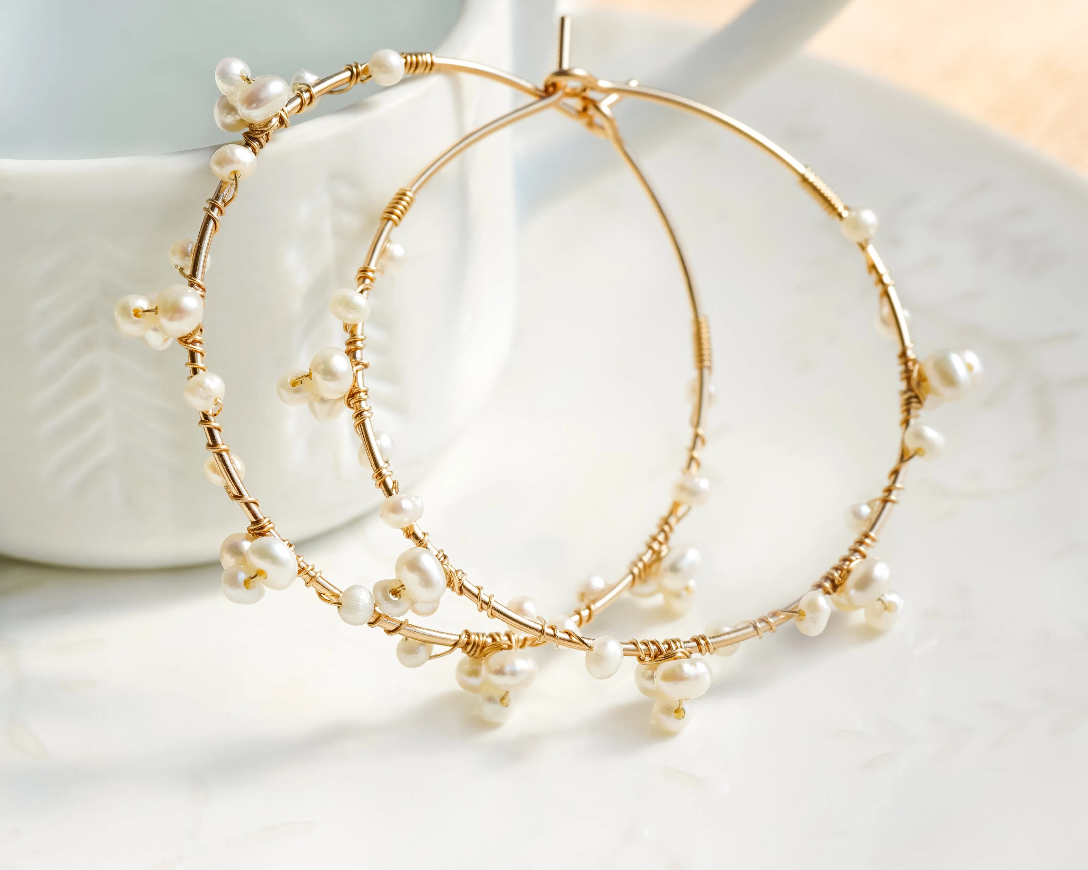 Tiny pearl wire wrapped gold hoop